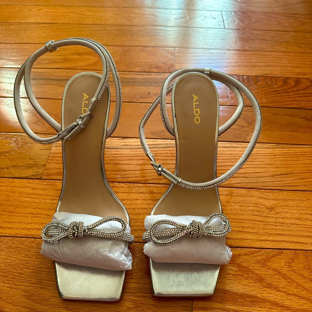 Brand new - never worn Aldo 4 inch heels. Silver with beautiful rhinestones!